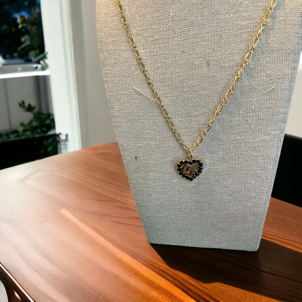 Gucci charm with black stones - includes necklace